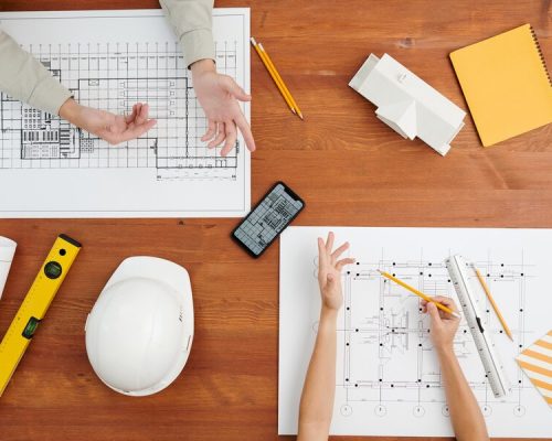 view-hands-creative-architects-discussion-sketches-blueprints-new-ideas-about-things-that-can-be-changed_274679-14489